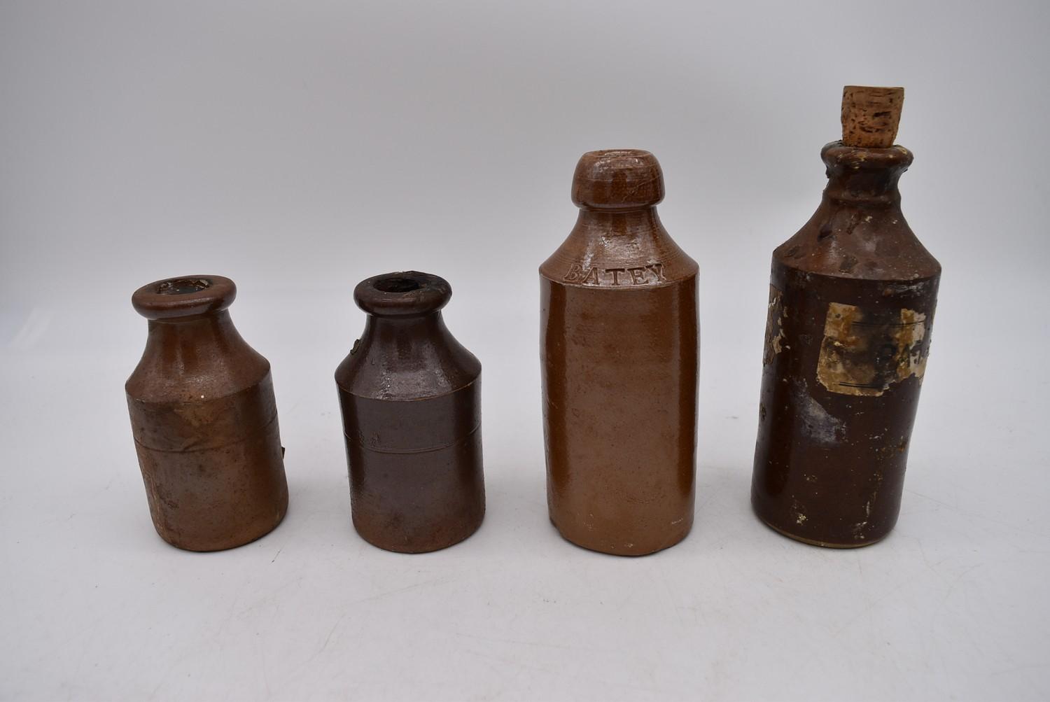 A collection of antique earthenware glazed bottles and jars, some with impressed makers marks. H. - Image 5 of 8