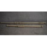 Two grey painted curtain poles and rings with carved finials. Longest L.230/Shortest L.167cm