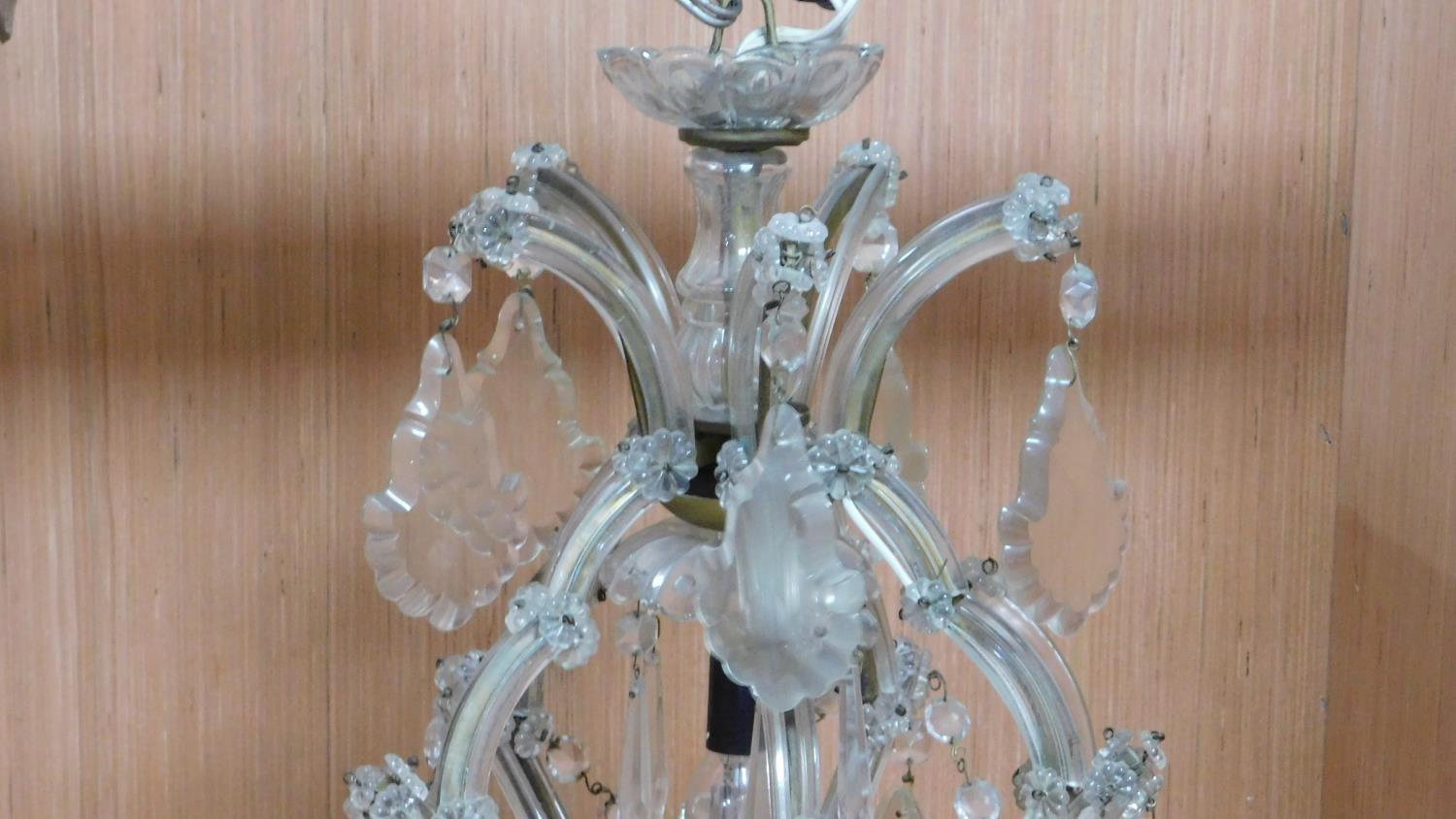 A twelve branch chandelier on a metal frame fitted with crystal swags and drops. H.80 W.75cm - Image 2 of 6