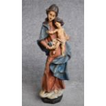 A carved wooden polychrome figure, Madonna and child. H.56cm