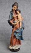 A carved wooden polychrome figure, Madonna and child. H.56cm