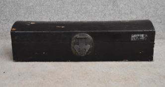 A Chinese black lacquered domed top box with twin carrying handles. H.15x60cm