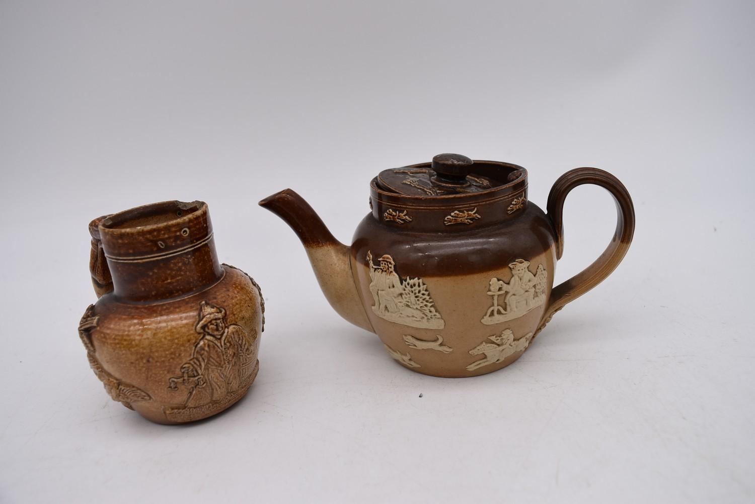 A collection of antique earthenware jugs and teapots and a hand painted porcelain oriental teapot. - Image 5 of 10