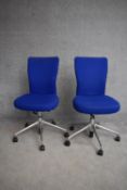 A pair of adjustable swivel office chairs. H.100cm