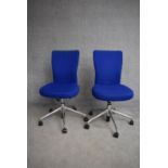A pair of adjustable swivel office chairs. H.100cm