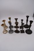 A pair of Art Nouveau inspired candlesticks and various other silver plated candlesticks. H.23cm (