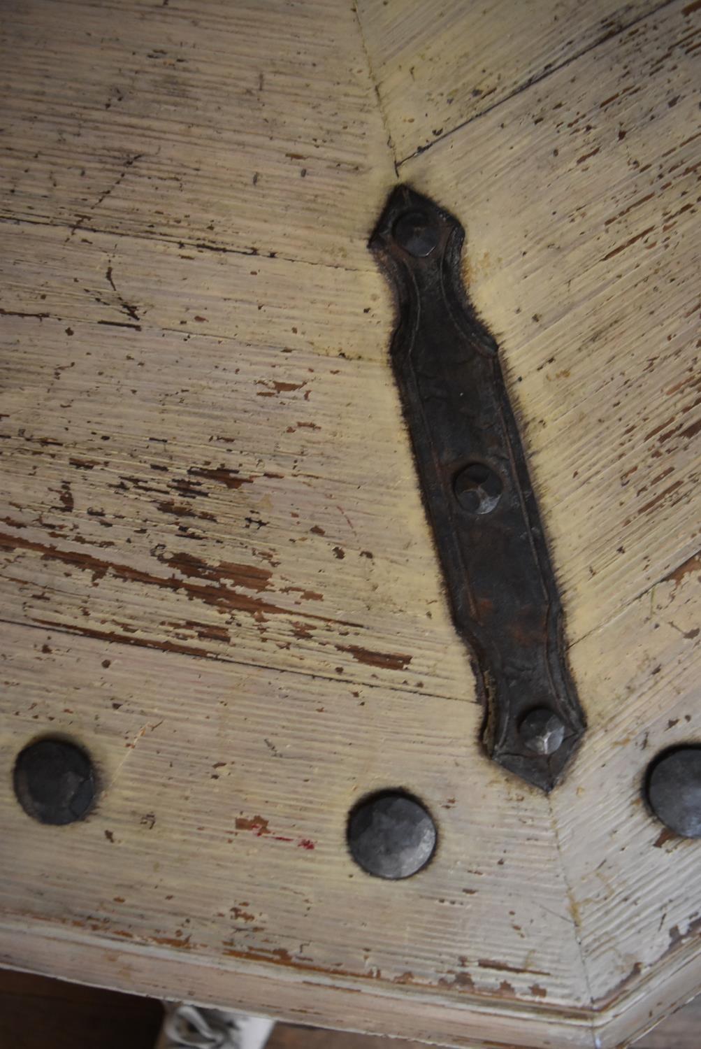 An Eastern distressed painted metal bound and studded octagonal table or garden seat with central - Image 4 of 4