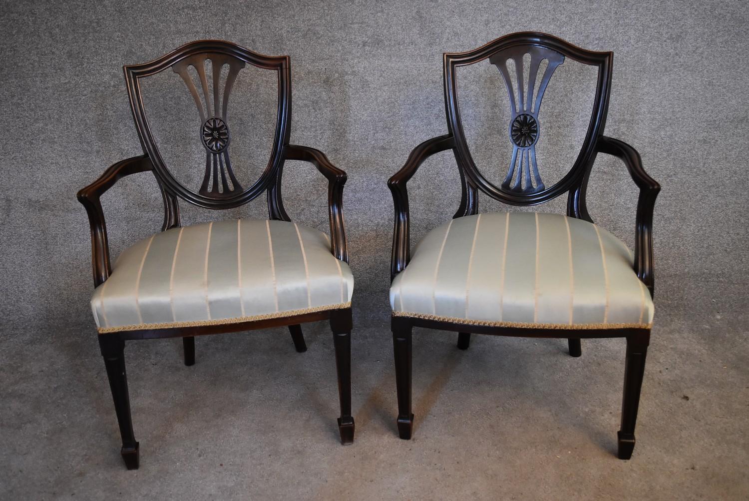 A pair of mahogany Hepplewhite style armchairs with striped damask stuffover seats on tapering