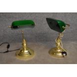 A pair of banker's desk lamps with green glass shades on brass bases. H.40cm