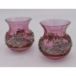 A pair of cranberry glass vases with allover white metal sycamore seed mounts. H.10cm