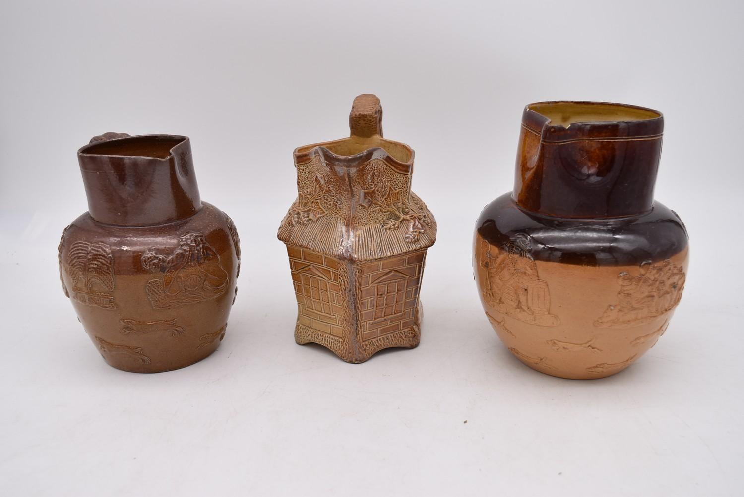 A collection of antique earthenware jugs and teapots and a hand painted porcelain oriental teapot. - Image 2 of 10