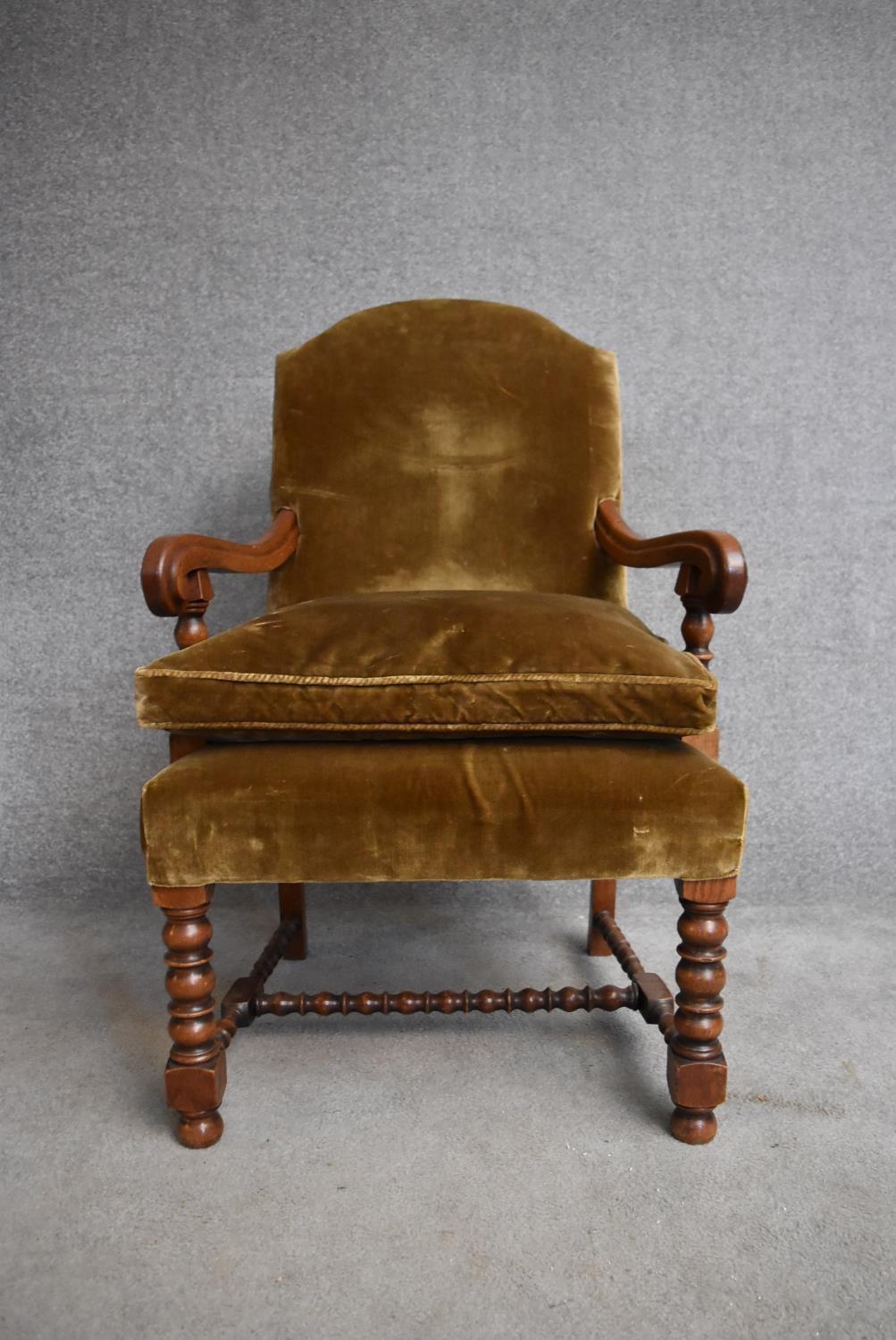 An oak framed antique style armchair with squab cushion on turned stretchered supports. H.100x65cm - Image 2 of 4