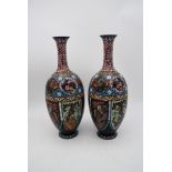 A pair of late 19th century Chinese cloisonné enamel vases with floral decoration and a phoenix