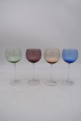 A set of four crystal coloured wine glasses. H.23cm