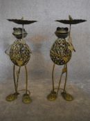 A pair of metal work garden bird tables in the shape of frogs holding lillypads. H.83cm