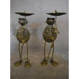 A pair of metal work garden bird tables in the shape of frogs holding lillypads. H.83cm