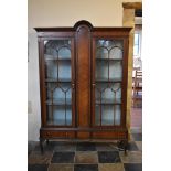 A late Victorian mahogany and ebonised domed top display cabinet with astragal glazed doors and