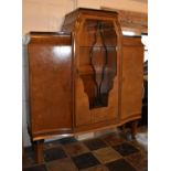 A Continental Art Deco burr walnut display cabinet fitted central astragal glazed section flanked by