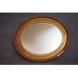 A 19th century gilt framed oval wall mirror. H.80x92cm