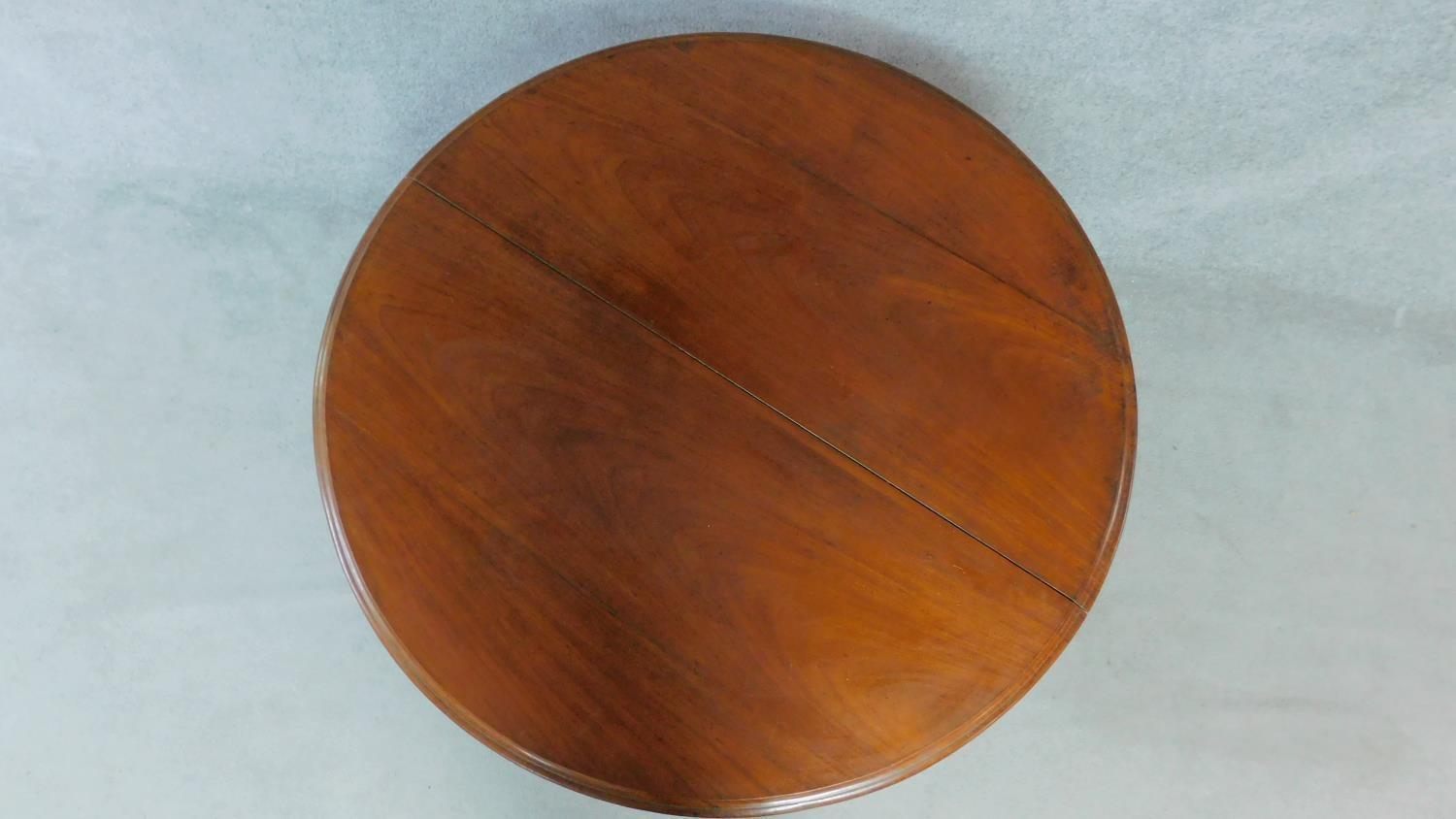 A Victorian mahogany circular dining table with tilt top action raised on carved tripod supports. - Image 3 of 7