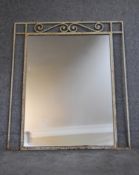 A mid 20th century white painted wrought iron pier mirror. H.105x90cm