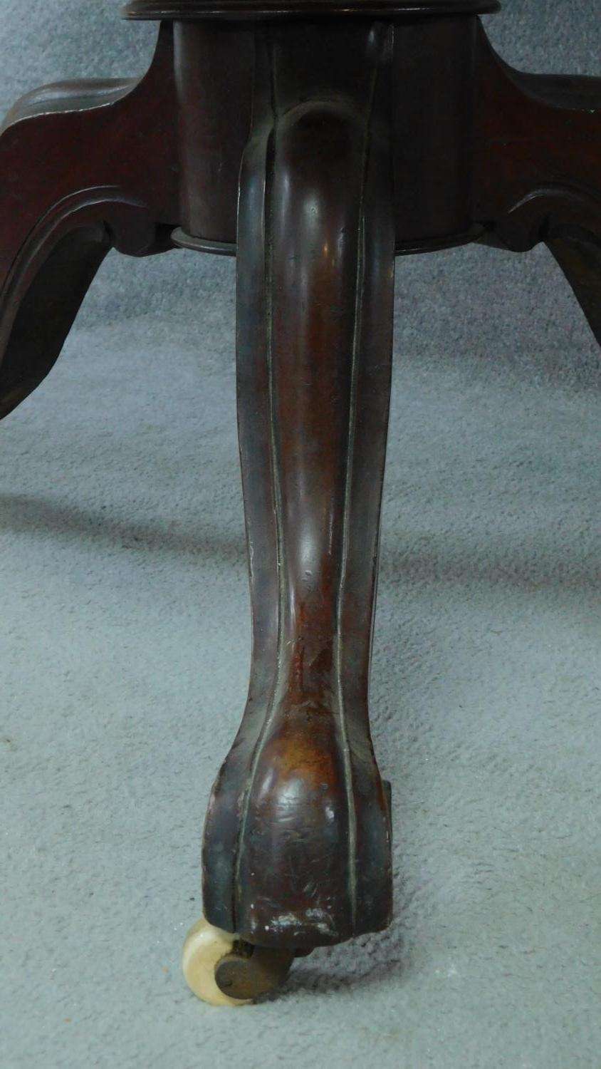 A Victorian mahogany circular dining table with tilt top action raised on carved tripod supports. - Image 5 of 7