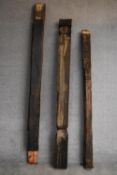Three miscellaneous Eastern carved hardwood door pilasters. H.233cm