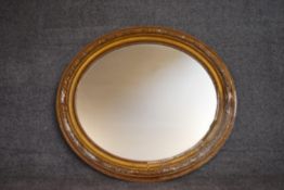 A 19th century gilt framed oval wall mirror. H.80x88cm