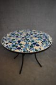 A metal framed conservatory table with mosaic inlaid top. H.72xDia.86cm