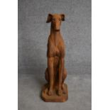 A moulded resin figure of a seated greyhound. H.80cm