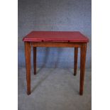 A 1960's vintage extending dining table with formica draw leaf top on beech supports. H.76x75cm (