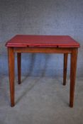 A 1960's vintage extending dining table with formica draw leaf top on beech supports. H.76x75cm (