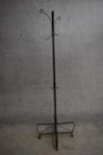 A wrought iron full height coatstand. H.187cm