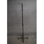 A wrought iron full height coatstand. H.187cm