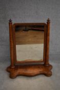 A 19th century burr walnut swing framed toilet mirror on shaped base. H.80x64cm