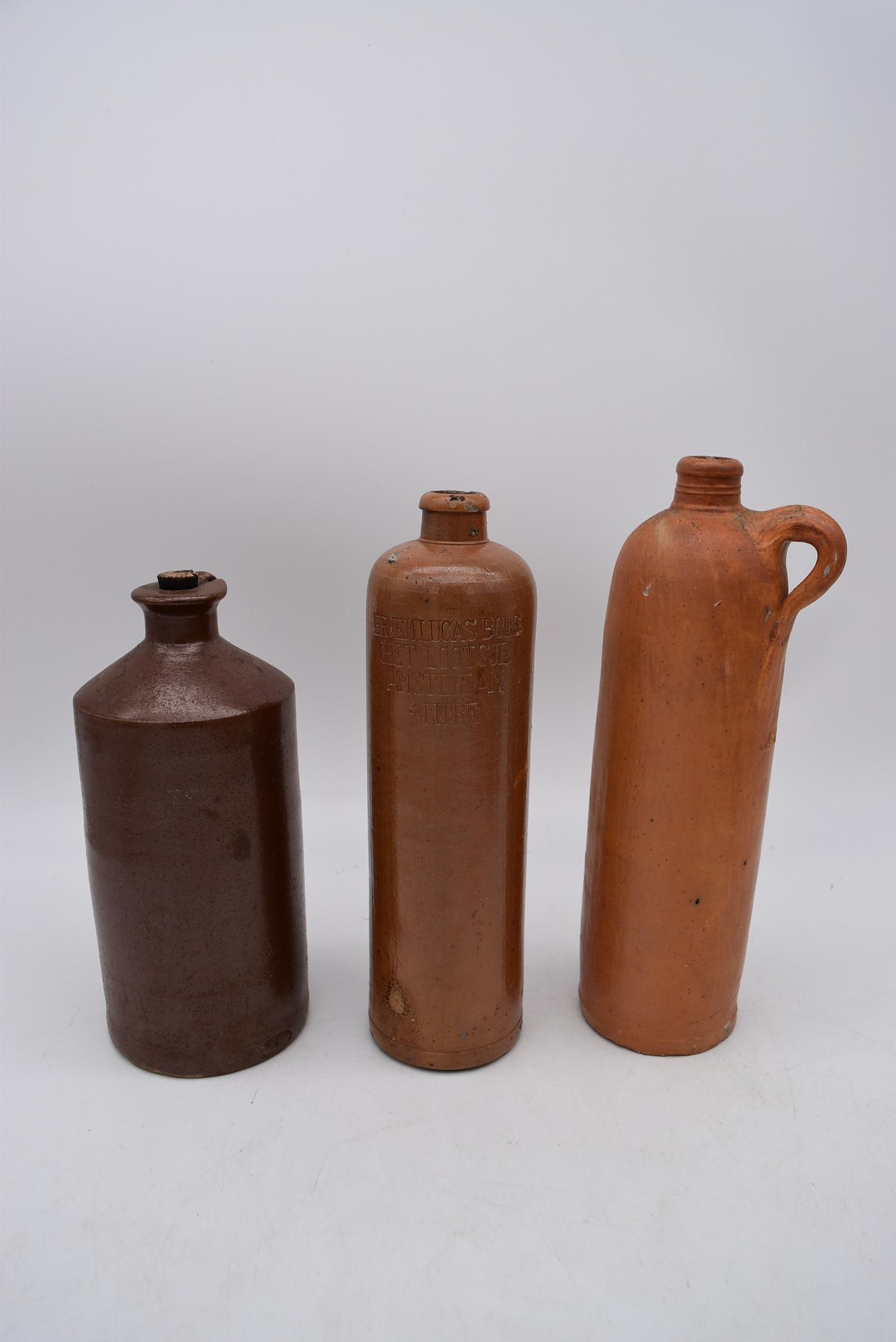 A collection of antique earthenware glazed bottles and jars, some with impressed makers marks. H. - Image 3 of 8