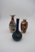 Three hand painted porcelain vintage Oriental vases. One decorated with a floral design, a ruffled