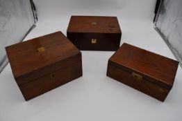 A 19th century walnut fitted box and two other similar boxes. H.14x28cm