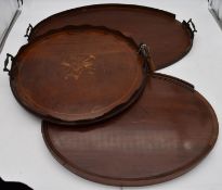 A late 19th century mahogany twin handled tray and two other similar trays. L.68x45cm