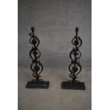 A pair of wrought iron finials on stands (from stair balusters) H.55cm