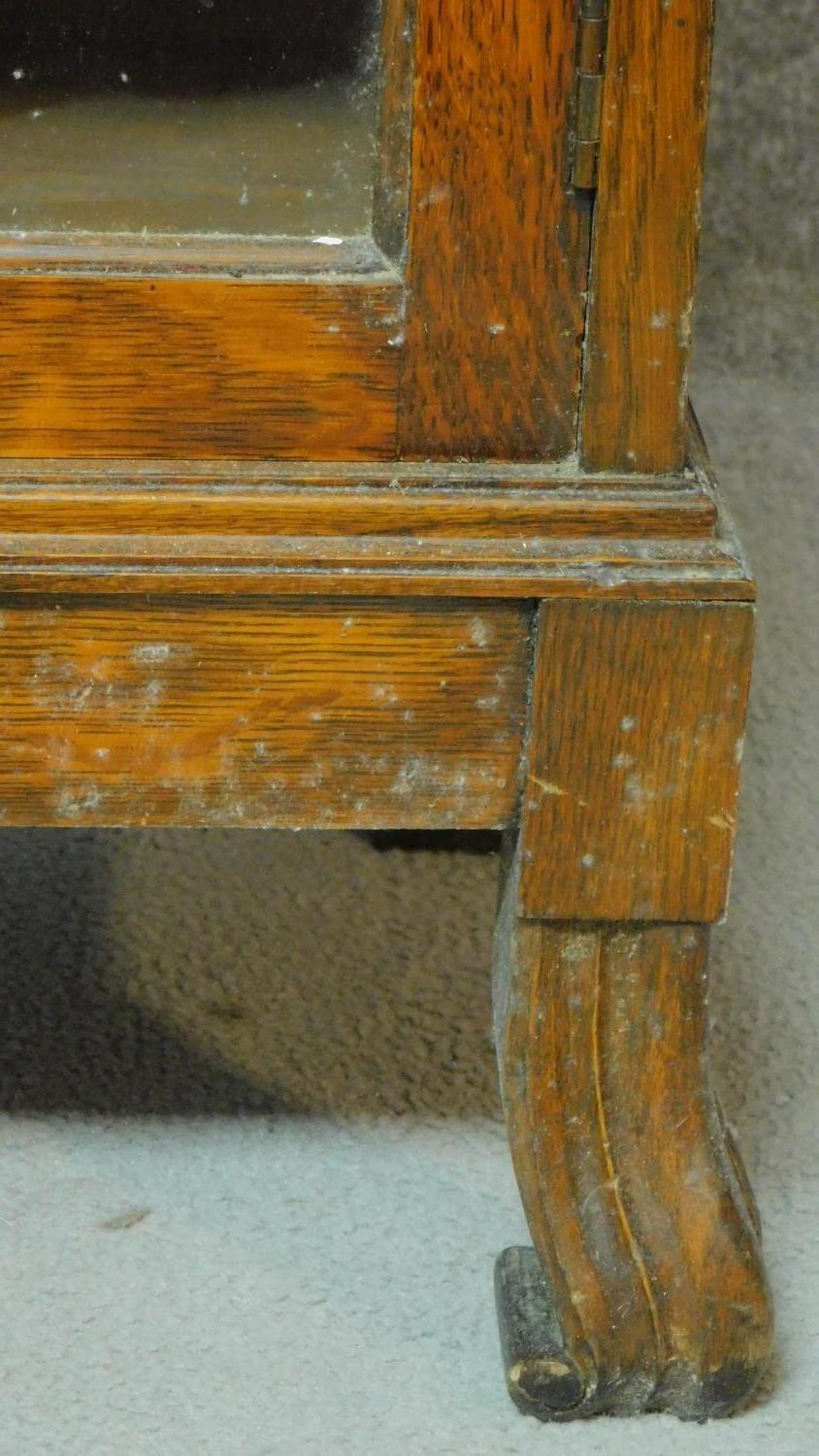 A mid 20th century carved oak bureau bookcase with central fitted secretaire section flanked by - Image 7 of 7