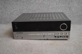 A vintage Harmon Kardon amplifier. (missing one foot) H.17x44cm