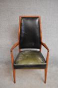 A 1960's vintage Danish teak and leather upholstered high back armchair. H.112x60cm