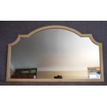 A mid 20th century arched white painted overmantel mirror. H.85x137cm