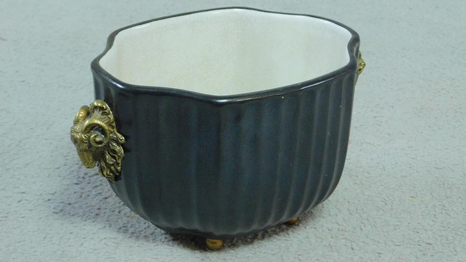 A Black antique style ribbed porcelain planter with two brass buck heads and mounted on brass - Image 2 of 4