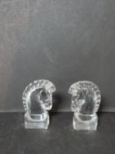 A pair of signed Art Deco Steuben crystal horses heads designed by Sidney Waugh. H12.5cm.