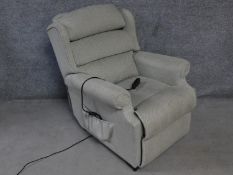 A Leggett & Platt reclining armchair with fully motorised back and footrest. H.105cm