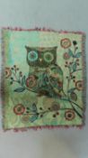 An embroidered throw with an owl on a branch with tassled edging. 150x125cm