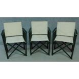 A set of three painted folding director's chairs with canvas seats and back. H.86 W.59 D.50cm