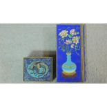 Two Meji period Japanese Cloisonne enamel boxes. One gilt bronze box on four raised feet with a